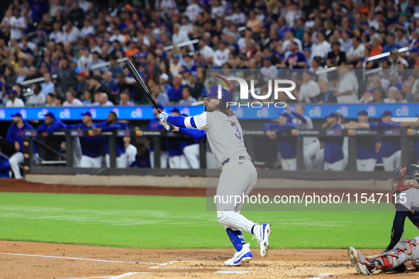 Jesse Winker of the New York Mets, #3, connects for a grand slam home run during the first inning of the baseball game against the Boston Re...