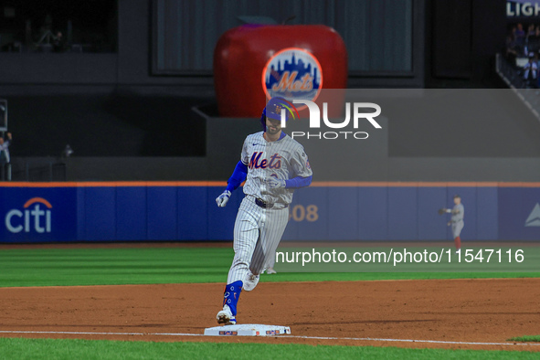 Jesse Winker #3 of the New York Mets rounds the bases after hitting a grand slam home run during the first inning of the baseball game again...