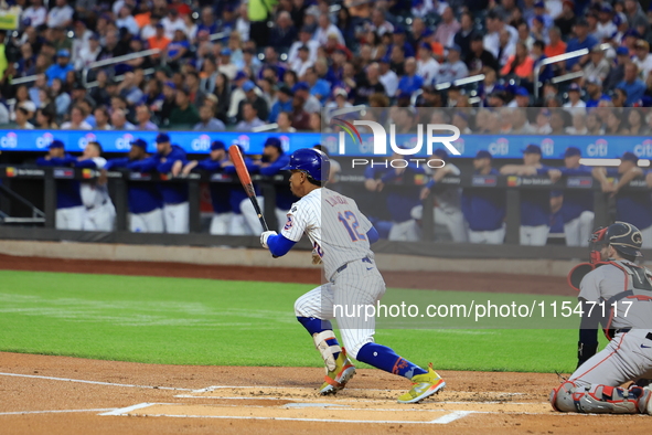 New York Mets Francisco Lindor #12 singles during the first inning of the baseball game against the Boston Red Sox at Citi Field in Corona,...