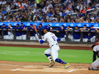 New York Mets Francisco Lindor #12 singles during the first inning of the baseball game against the Boston Red Sox at Citi Field in Corona,...