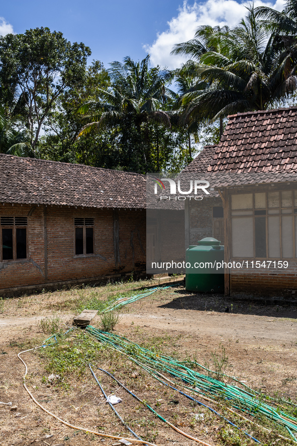 A number of water hoses are around the house and road surface during drought season in Selopamioro Village, Bantul Regency, Yogyakarta Provi...