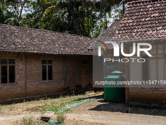 A number of water hoses are around the house and road surface during drought season in Selopamioro Village, Bantul Regency, Yogyakarta Provi...