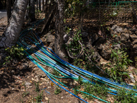 A number of water hoses are around the house and road surface during drought season in Selopamioro Village, Bantul Regency, Yogyakarta Provi...