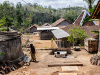 A villager stands near the water source as he waits to collect water during the drought season in Tepus Village, Gunung Kidul Regency, Yogya...