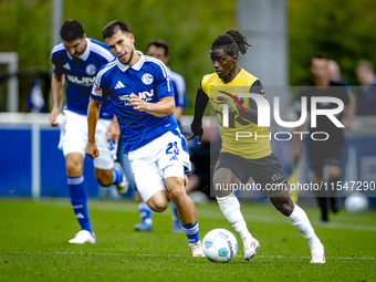 SC Schalke 04 player Mehmet Can Aydin and NAC player Sana Fernandes during the match Schalke 04 vs. NAC (friendly) at the Parkstadium for th...