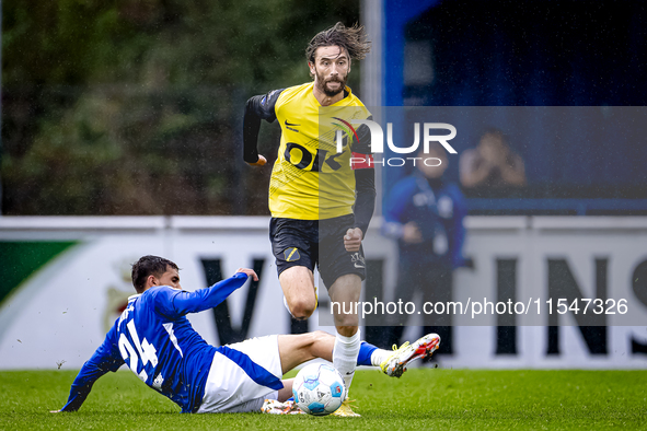 SC Schalke 04 player Ilyes Hamache and NAC player Jan van den Berg during the match Schalke 04 vs. NAC (friendly) at the Parkstadium for the...