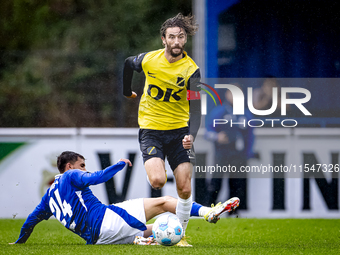 SC Schalke 04 player Ilyes Hamache and NAC player Jan van den Berg during the match Schalke 04 vs. NAC (friendly) at the Parkstadium for the...