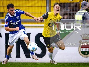 SC Schalke 04 player Mehmet Can Aydin and NAC player Kacper Kostorz during the match Schalke 04 vs. NAC (friendly) at the Parkstadium in Gel...