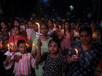 Citizens light candles in solidarity with the victim doctor who was raped and murdered at RG Kar Medical College and Hospital, during a prot...