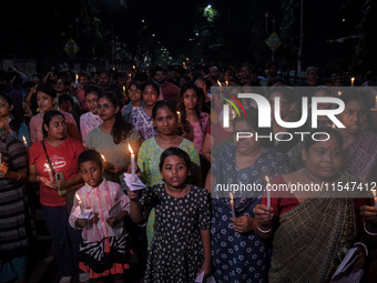 Citizens light candles in solidarity with the victim doctor who was raped and murdered at RG Kar Medical College and Hospital, during a prot...