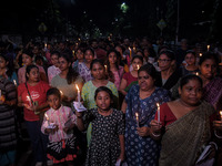 Citizens light candles in solidarity with the victim doctor who was raped and murdered at RG Kar Medical College and Hospital, during a prot...