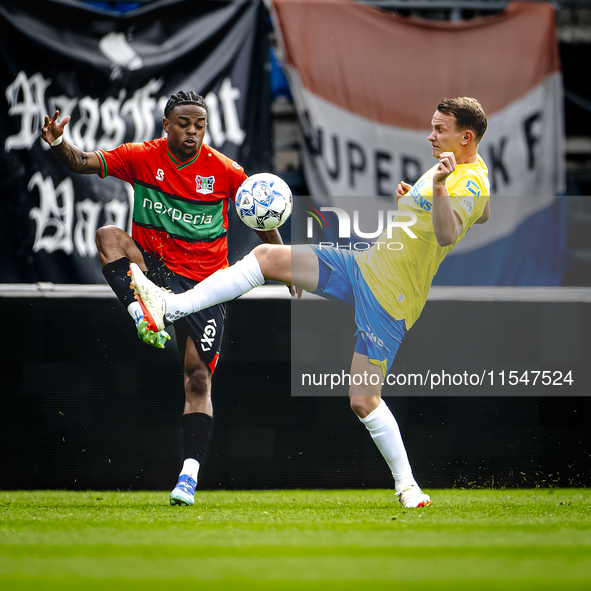 NEC player Sontje Hansen and RKC player Julian Lelieveld during the match RKC vs. NEC (friendly) at the Mandemakers Stadium for the Dutch Er...