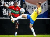 NEC player Sontje Hansen and RKC player Julian Lelieveld during the match RKC vs. NEC (friendly) at the Mandemakers Stadium for the Dutch Er...