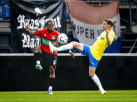 NEC player Sontje Hansen and RKC player Julian Lelieveld during the match RKC vs. NEC (friendly) at the Mandemakers Stadium for the Dutch Er...