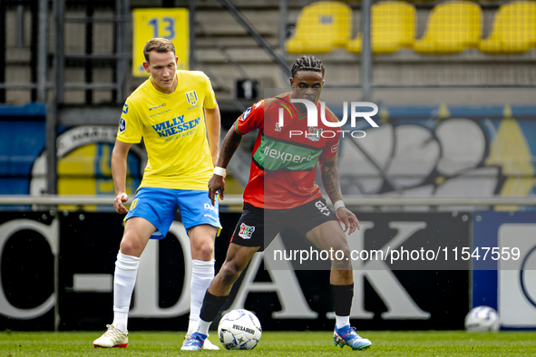 RKC player Julian Lelieveld and NEC player Sontje Hansen during the match RKC vs. NEC (friendly) at the Mandemakers Stadium for the Dutch Er...