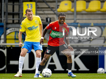 RKC player Julian Lelieveld and NEC player Sontje Hansen during the match RKC vs. NEC (friendly) at the Mandemakers Stadium for the Dutch Er...