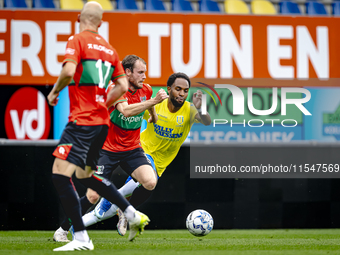 NEC player Thomas Ouwejan and RKC player Denilho Cleonise during the match RKC vs. NEC (friendly) at the Mandemakers Stadium for the Dutch E...