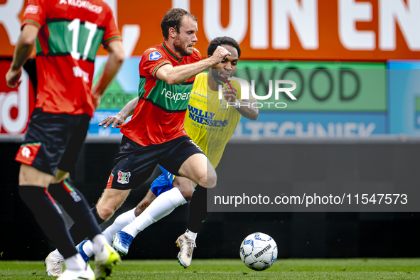 NEC player Thomas Ouwejan and RKC player Denilho Cleonise during the match RKC vs. NEC (friendly) at the Mandemakers Stadium for the Dutch E...