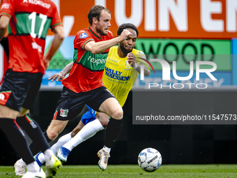 NEC player Thomas Ouwejan and RKC player Denilho Cleonise during the match RKC vs. NEC (friendly) at the Mandemakers Stadium for the Dutch E...