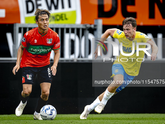 NEC player Kosai Sano and RKC player Patrick Vroegh during the match RKC vs. NEC (friendly) at the Mandemakers Stadium for the Dutch Eredivi...