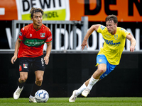 NEC player Kosai Sano and RKC player Patrick Vroegh during the match RKC vs. NEC (friendly) at the Mandemakers Stadium for the Dutch Eredivi...