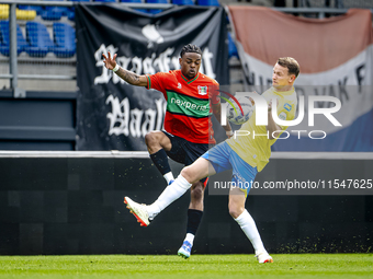 NEC player Sontje Hansen and RKC player Julian Lelieveld during the match RKC vs. NEC (friendly) at the Mandemakers Stadium for the Dutch Er...