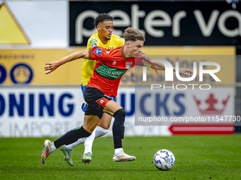 NEC player Luc Nieuwenhuijs and RKC player Daouda Weidmann during the match RKC vs. NEC (friendly) at the Mandemakers Stadium for the Dutch...