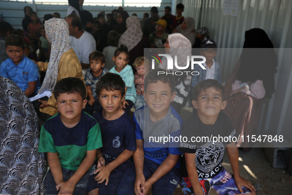 Palestinian children receive polio vaccinations at the UK-MED field hospital in Khan Younis in the southern Gaza Strip, on September 5, 2024...