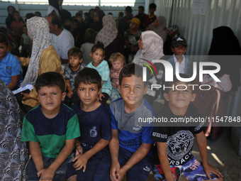 Palestinian children receive polio vaccinations at the UK-MED field hospital in Khan Younis in the southern Gaza Strip, on September 5, 2024...