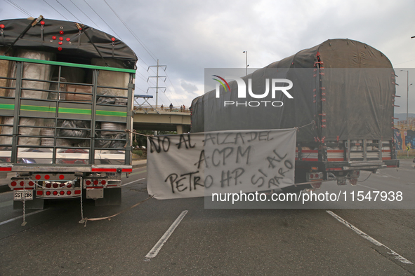 A sign in some tractor-trailers says "no to the increase of the ACPM" in Bogota, Colombia, on September 4, 2024. Truckers mainly protest aga...