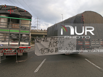 A sign in some tractor-trailers says "no to the increase of the ACPM" in Bogota, Colombia, on September 4, 2024. Truckers mainly protest aga...