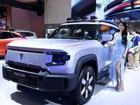 A model displays a new car at the 23rd Autumn International Auto Show in Qingdao, China, on September 5, 2024. (