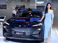 A model displays a new car at the 23rd Autumn International Auto Show in Qingdao, China, on September 5, 2024. (