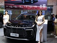 A model displays a new car at the 23rd Autumn International Auto Show in Qingdao, China, on September 5, 2024. (