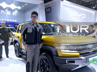 A model displays a new car at the 23rd Autumn International Auto Show in Qingdao, China, on September 5, 2024. (