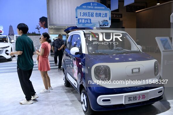 Promotional information about replacement vehicles is seen at the 23rd Autumn International Auto Show 2024 in Qingdao, China, on September 5...