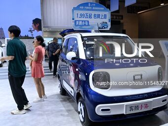 Promotional information about replacement vehicles is seen at the 23rd Autumn International Auto Show 2024 in Qingdao, China, on September 5...