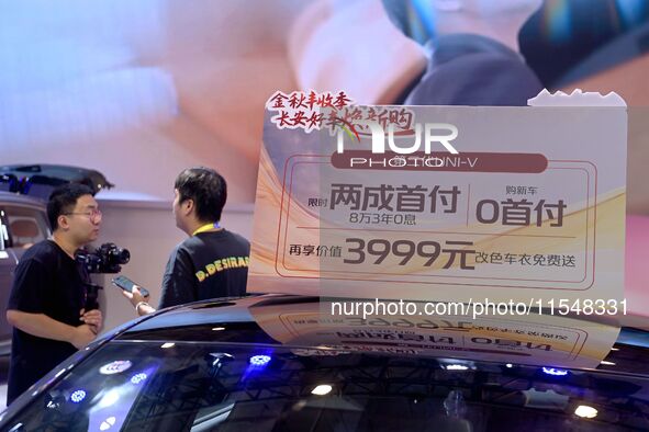 Promotional information about replacement vehicles is seen at the 23rd Autumn International Auto Show 2024 in Qingdao, China, on September 5...