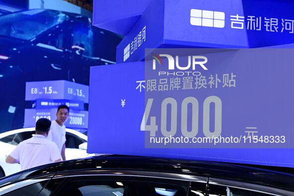 Promotional information about replacement vehicles is seen at the 23rd Autumn International Auto Show 2024 in Qingdao, China, on September 5...