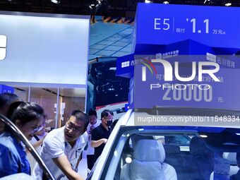 Promotional information about replacement vehicles is seen at the 23rd Autumn International Auto Show 2024 in Qingdao, China, on September 5...