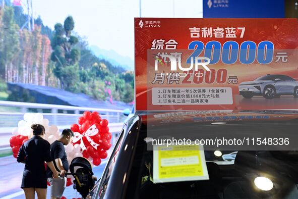 Promotional information about replacement vehicles is seen at the 23rd Autumn International Auto Show 2024 in Qingdao, China, on September 5...