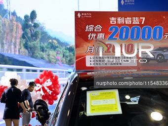 Promotional information about replacement vehicles is seen at the 23rd Autumn International Auto Show 2024 in Qingdao, China, on September 5...