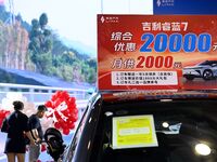 Promotional information about replacement vehicles is seen at the 23rd Autumn International Auto Show 2024 in Qingdao, China, on September 5...