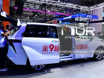 Promotional information about replacement vehicles is seen at the 23rd Autumn International Auto Show 2024 in Qingdao, China, on September 5...