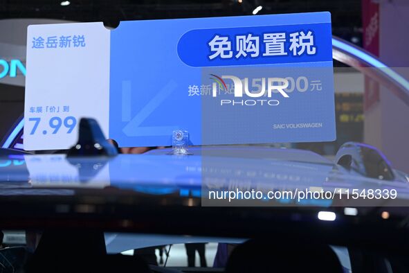 Promotional information about replacement vehicles is seen at the 23rd Autumn International Auto Show 2024 in Qingdao, China, on September 5...