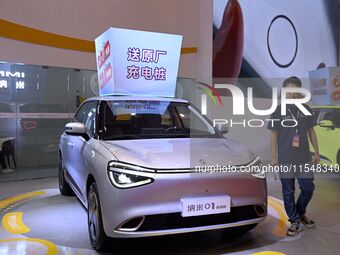 Promotional information about replacement vehicles is seen at the 23rd Autumn International Auto Show 2024 in Qingdao, China, on September 5...