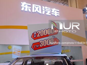 Promotional information about replacement vehicles is seen at the 23rd Autumn International Auto Show 2024 in Qingdao, China, on September 5...