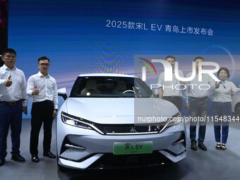 A new car is unveiled at the 23rd Autumn International Auto Show in Qingdao, China, on September 5, 2024. (