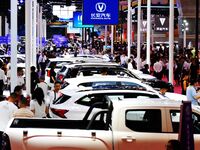 People look at various vehicles at the 23rd Autumn International Auto Show in Qingdao, China, on September 5, 2024. (