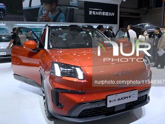 People look at various vehicles at the 23rd Autumn International Auto Show in Qingdao, China, on September 5, 2024. (